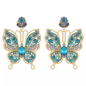 earrings in teal with butterfly and rhinestone embellishment