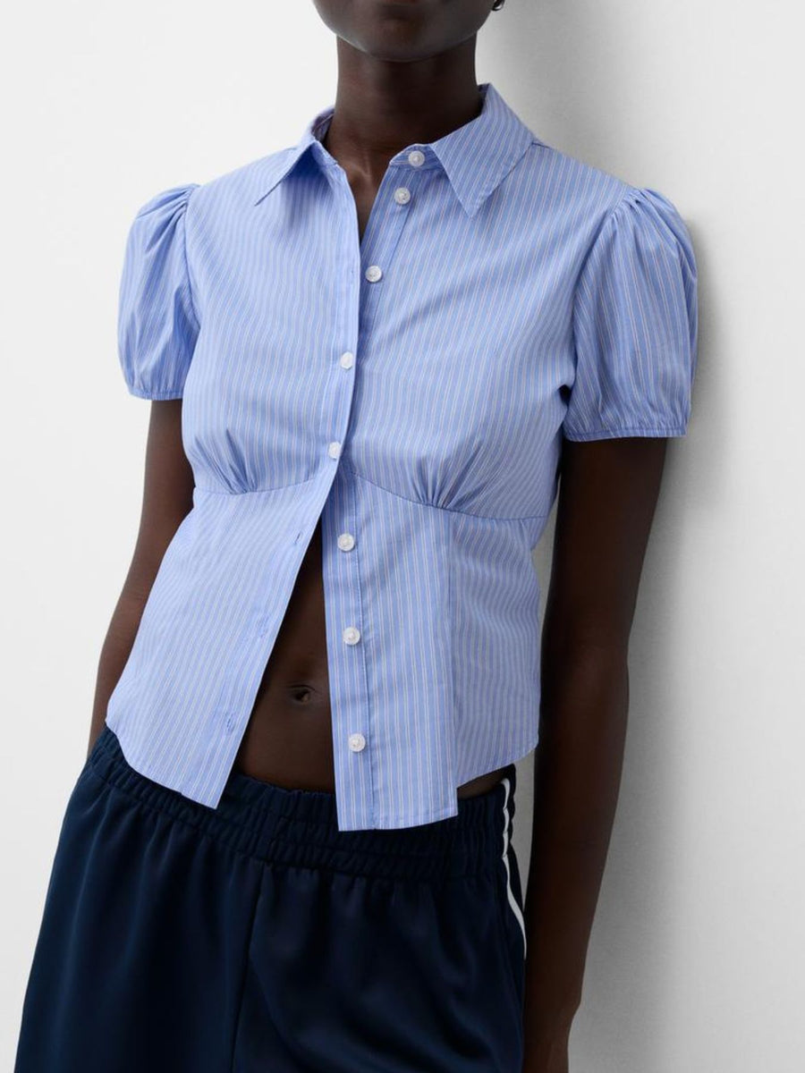 Light blue pinstripe puff sleeve button-up shirt with a fitted waist