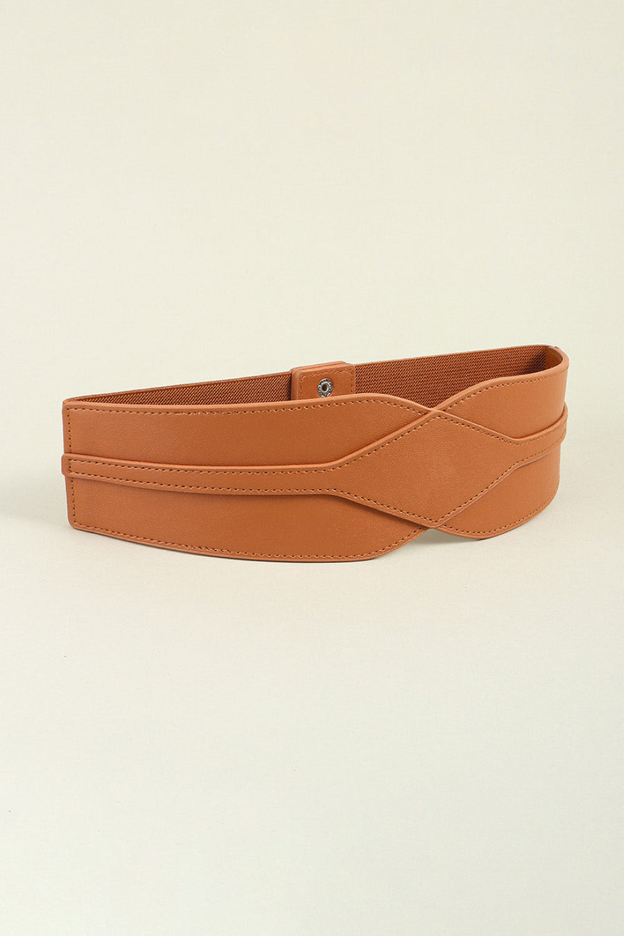 Caramel elastic waist belt with sculpted faux leather overlay and snap closure