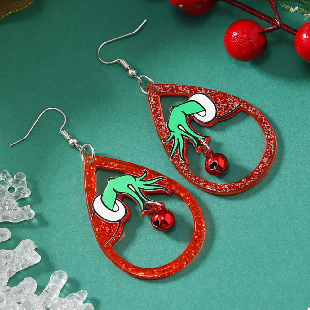 Acrylic teardrop earrings with Grinch hands holding red bells, glitter red outline