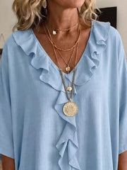 White relaxed blouse with v-neck