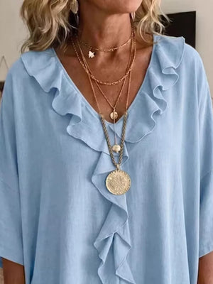 White relaxed blouse with v-neck