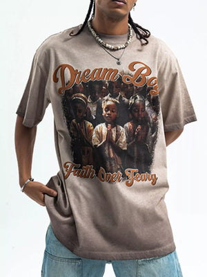 Khaki graphic t-shirt with puff sleeves, featuring "Dream Big Faith Over Fear" text and a graphic of children praying.