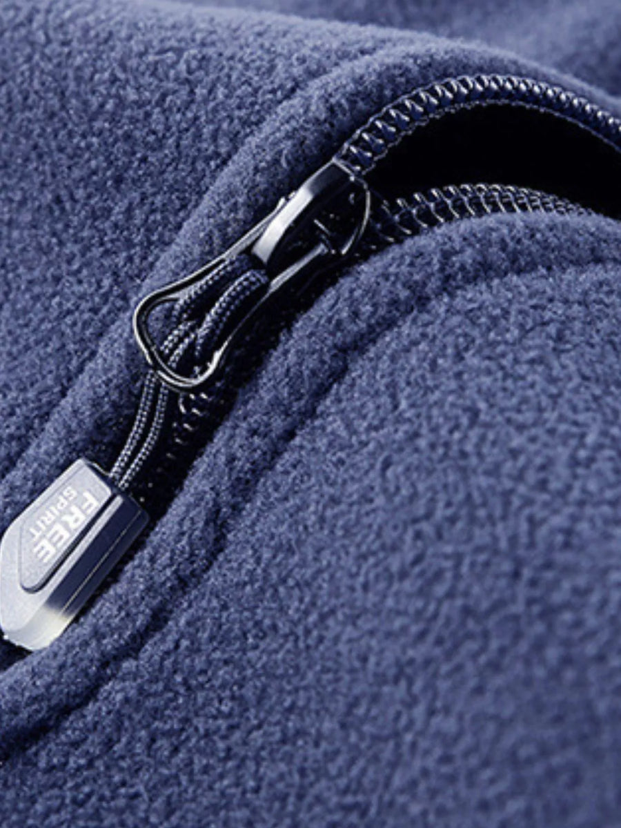 Blue fleece quarter zip sweatshirt detail with zipper pull showing Free Spirit text