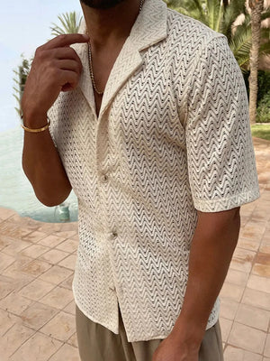 Ivory open-knit herringbone resort shirt with a spread collar and short sleeves.