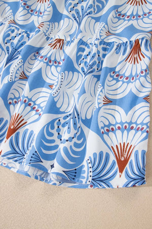 Botanic print ruffled dress with flutter sleeves and tiered hem in blue and white.