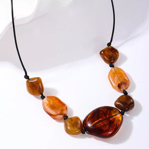 18K Gold-Plated, Alloy, Acrylic Care instructions: Avoid wearing during exercise necklace in caramel brown with straight