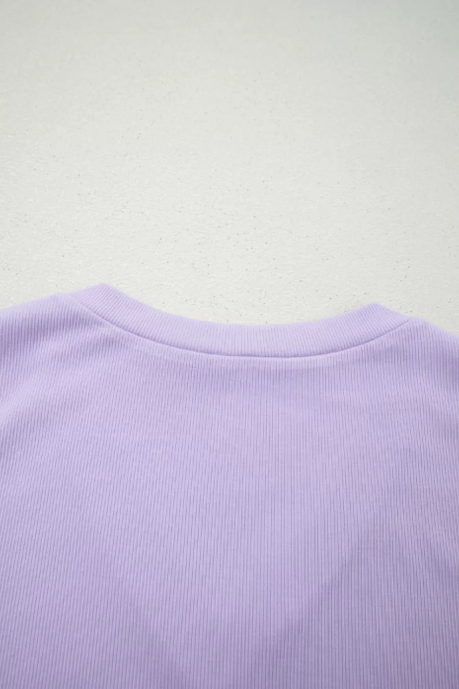 Lilac ribbed bodice detail of a floral maxi dress