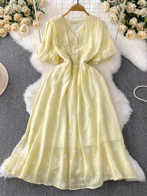 Yellow embroidered puff sleeve midi dress with button front and V-neck