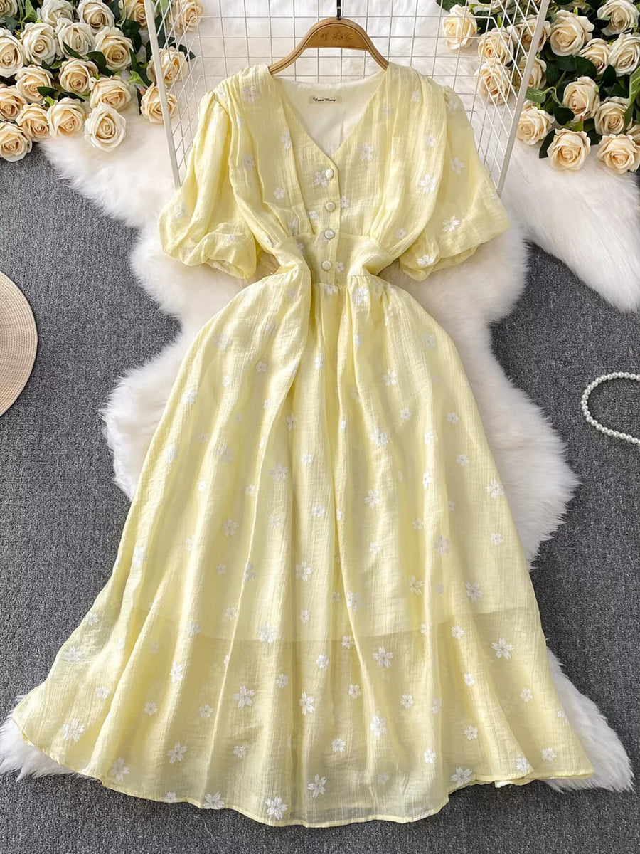 Yellow embroidered puff sleeve midi dress with button front and V-neck