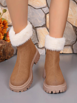 Camel suede ankle boots with white faux fur trim and lug soles.