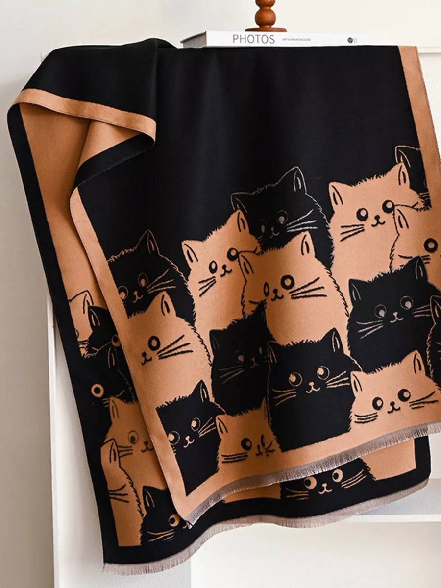 Reversible black and tan scarf with a cute all-over cat pattern.