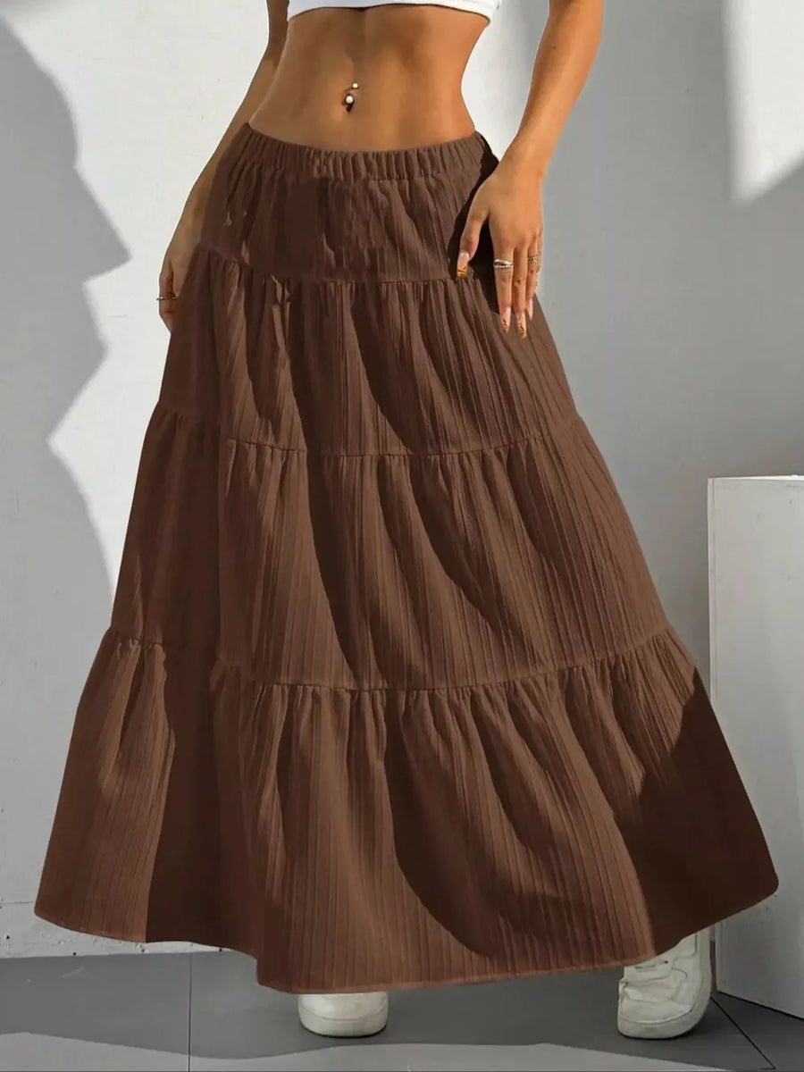 Brown tiered maxi skirt with elastic waistband and textured fabric