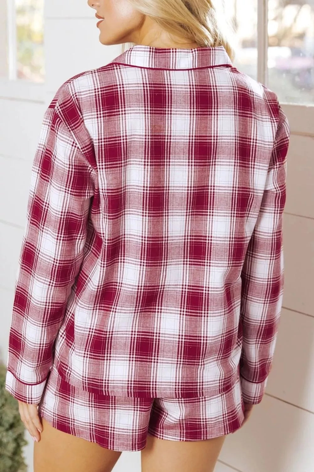 Cozy red plaid cotton pajama set with buttoned top and shorts.