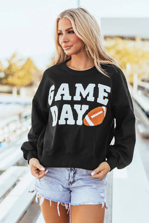 Black sweatshirt with white GAME DAY graphic and football applique.