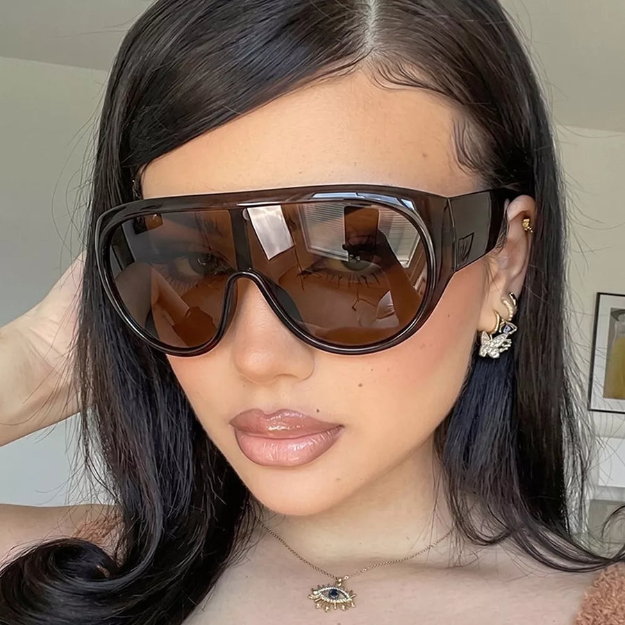PC Frame material: Polycarbonate Lens material: Polycarbonate Temple material: P sunglasses in Black with oversized