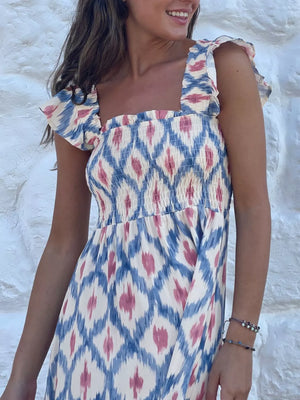 Smocked ruffle sleeve maxi dress with blue and pink ikat print.