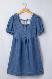 Denim puff sleeve square neck dress with button front and back tie detail.