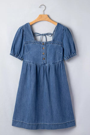 Denim puff sleeve square neck dress with button front and back tie detail.