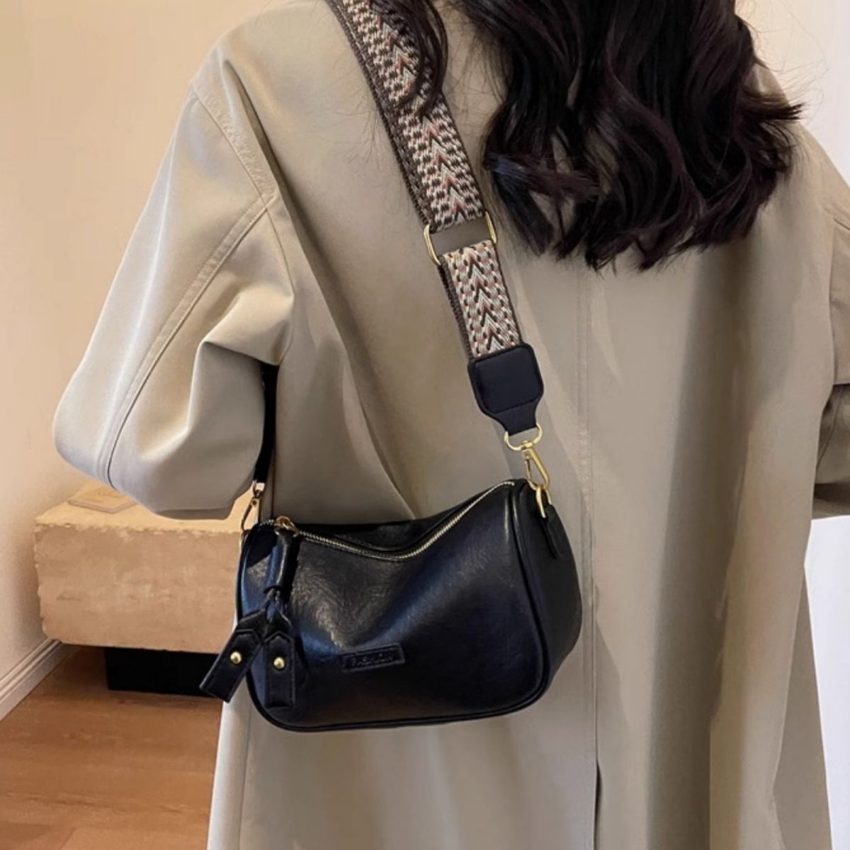 Textured black pu leather crossbody bag with patterned strap