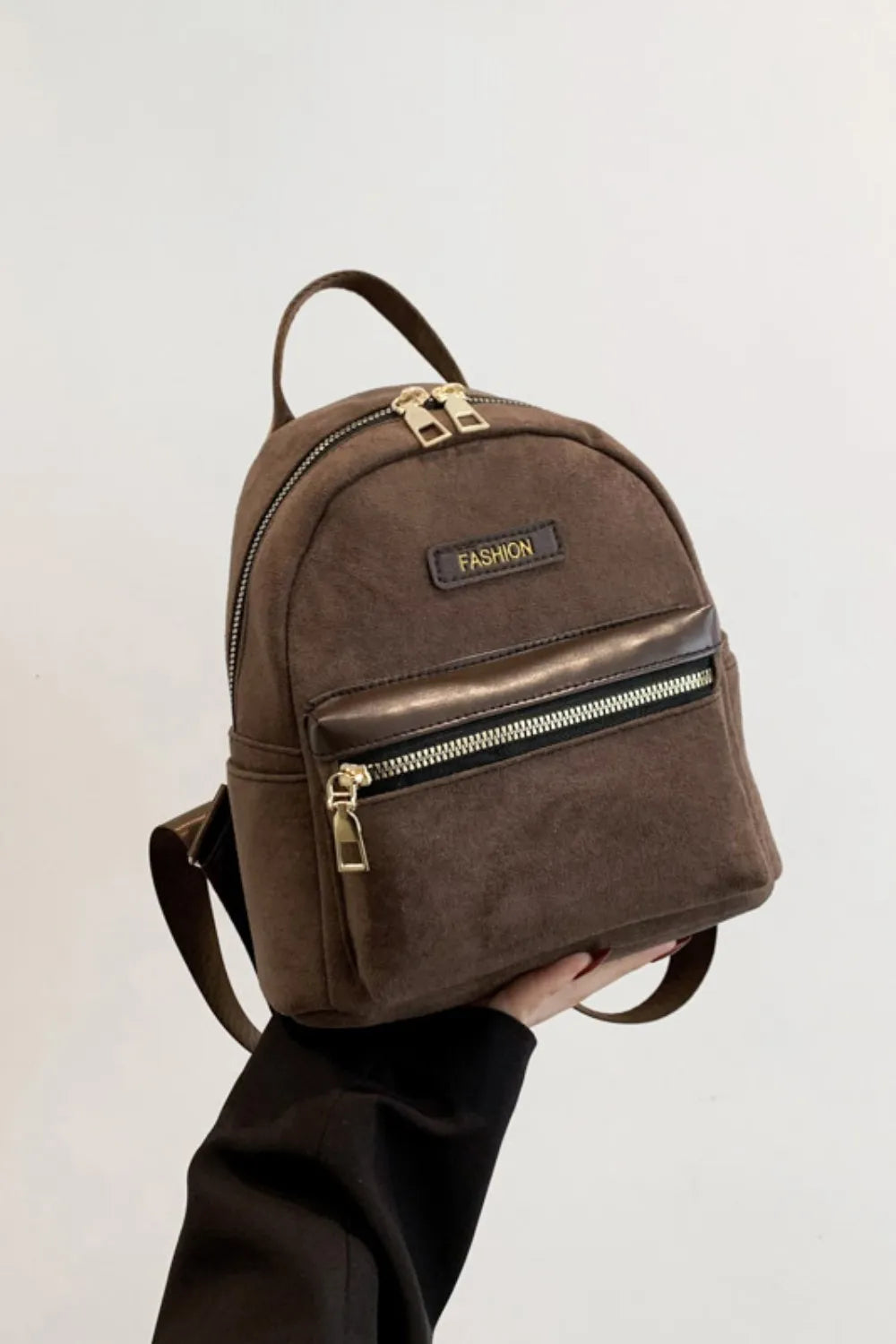 Coffee brown suede mini backpack with golden zips and "FASHION" detail