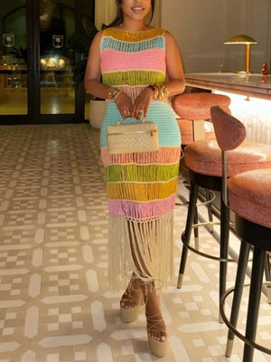 Vibrant color block knit maxi dress with fringe and a leg slit, sleeveless, crew neck.