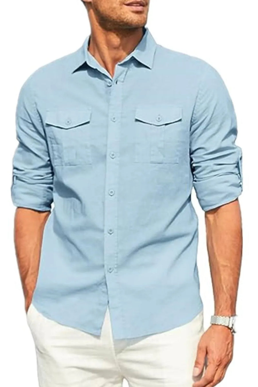 Light blue linen utility shirt with two chest pockets and rolled sleeves.