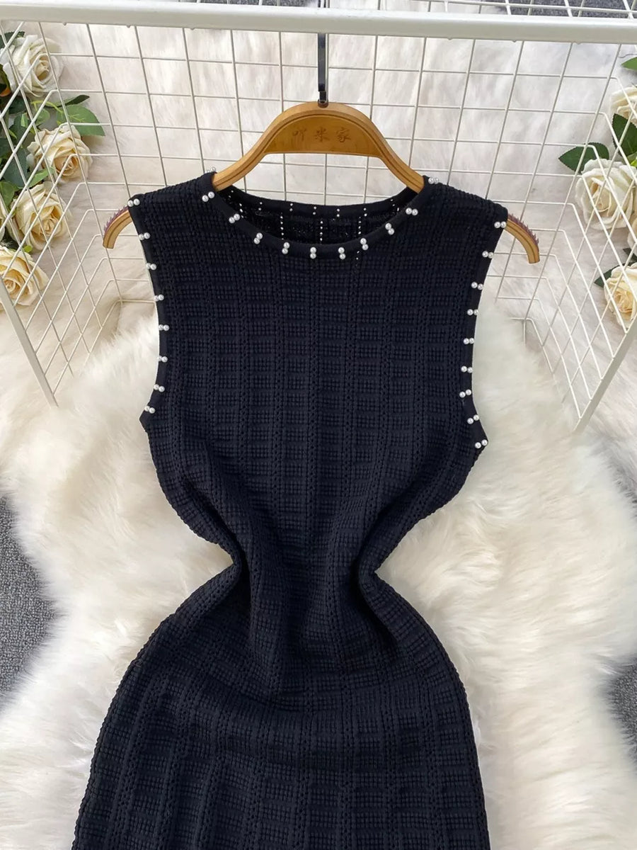 Black textured knit midi dress with pearl neckline and cutout details
