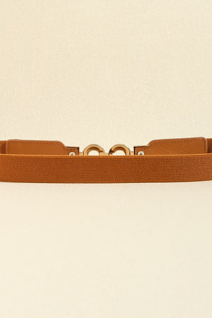 Caramel elastic belt with gold interlocking buckle detail and faux leather tab