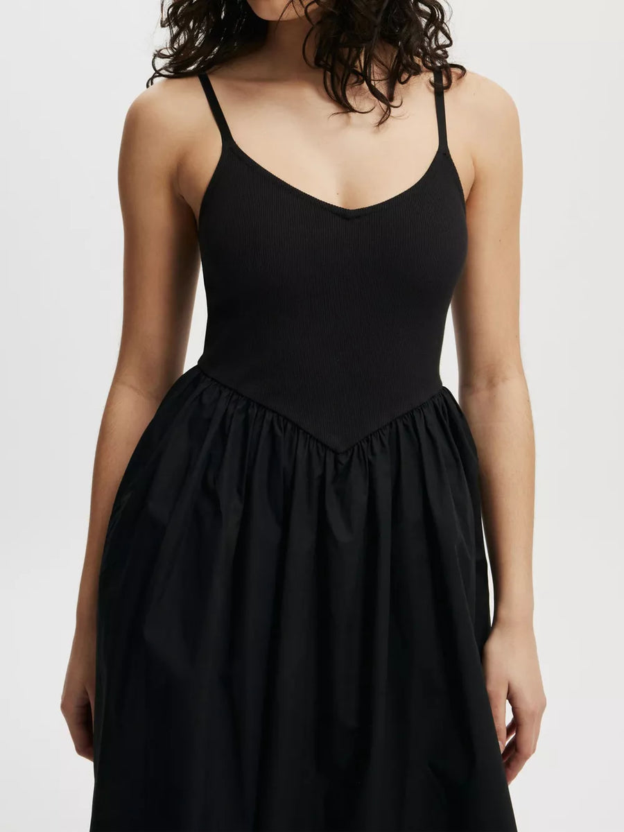 Black midi dress with V-neck ribbed bodice and full skirt