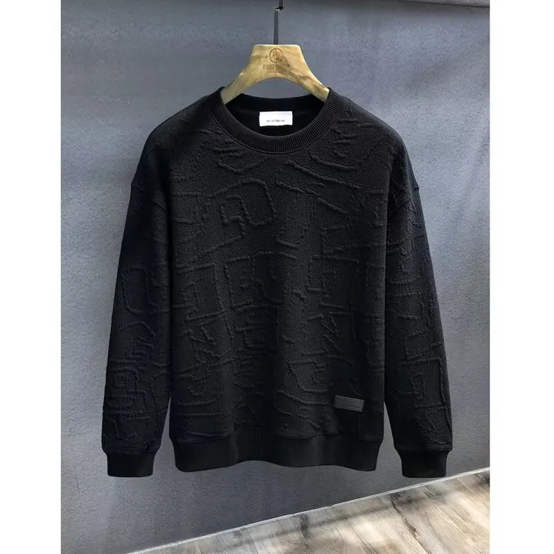 Black crewneck sweatshirt with embossed geometric texture and ribbed cuffs.