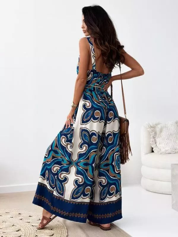 Paisley patterned tied wide-leg romper in Peacock Blue with a cinched waist and flowing legs.