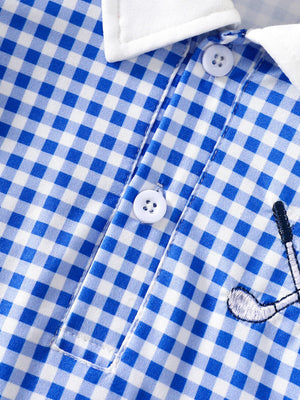 Blue gingham baby dress with white polo collar, buttons, and golf club embroidery.