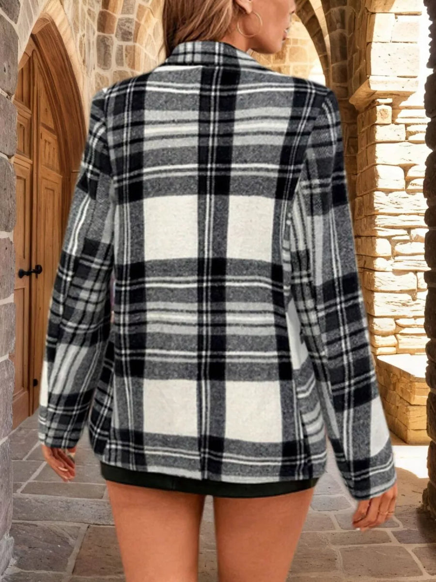 Black and white plaid single-button blazer with a classic collar and long sleeves.