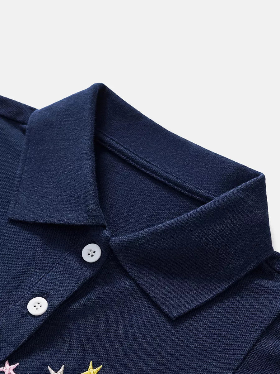 Navy blue polo shirt with embroidered stars and white buttons
