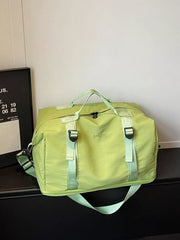 Green nylon travel bag with crinkled texture and adjustable buckle straps.