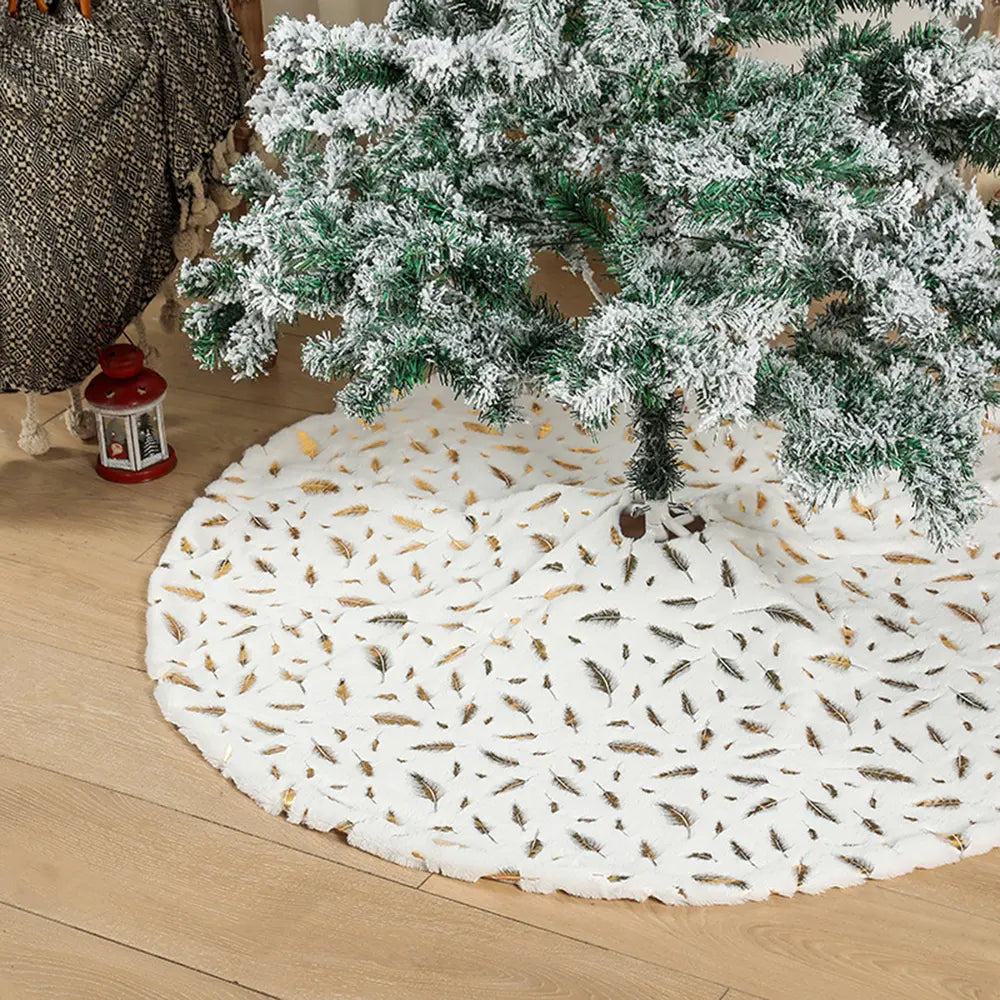 White Christmas tree skirt with gold and black feather pattern