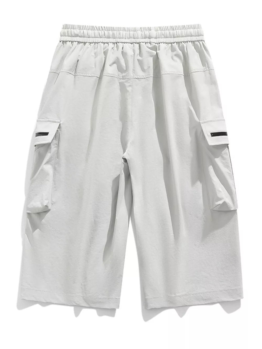 Light gray cargo shorts with elastic waistband and zippered pockets.