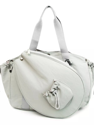 Light gray athletic nylon tote with racket holder and cinch-cord pocket.