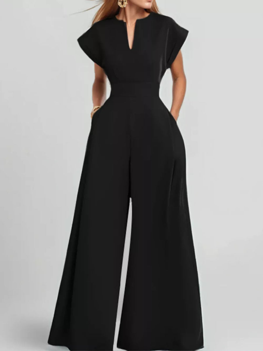 Black wide-leg romper with notched neckline and pockets