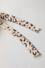 Knot detail leopard print tank top in black and cream with adjustable straps.