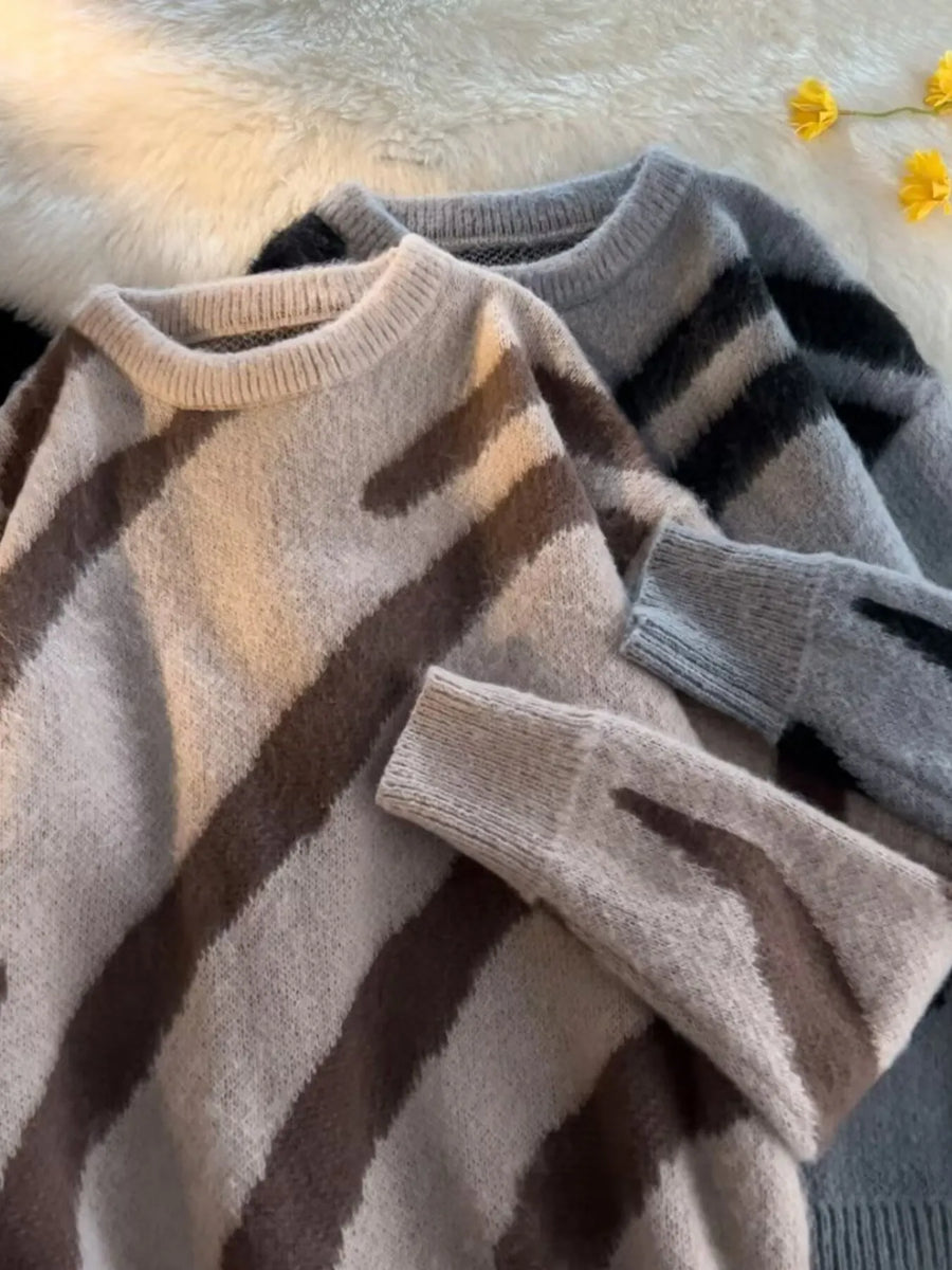 Oversized fuzzy knit pullover sweater in khaki with brown stripes and a grey option with black stripes.