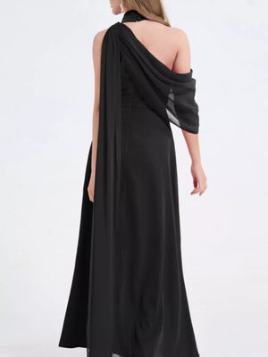 Black asymmetrical maxi dress with draped chiffon and high slit.