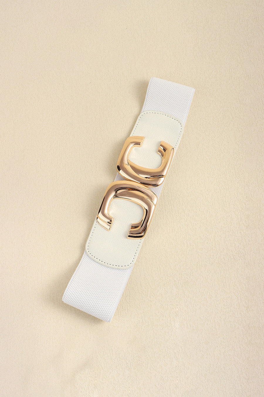 White elastic waist belt with gold double-C buckle detail