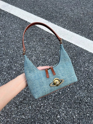 Denim shoulder bag with planet charm and brown strap