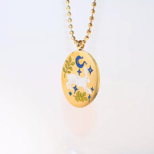silver necklace featuring pendant and pictorial