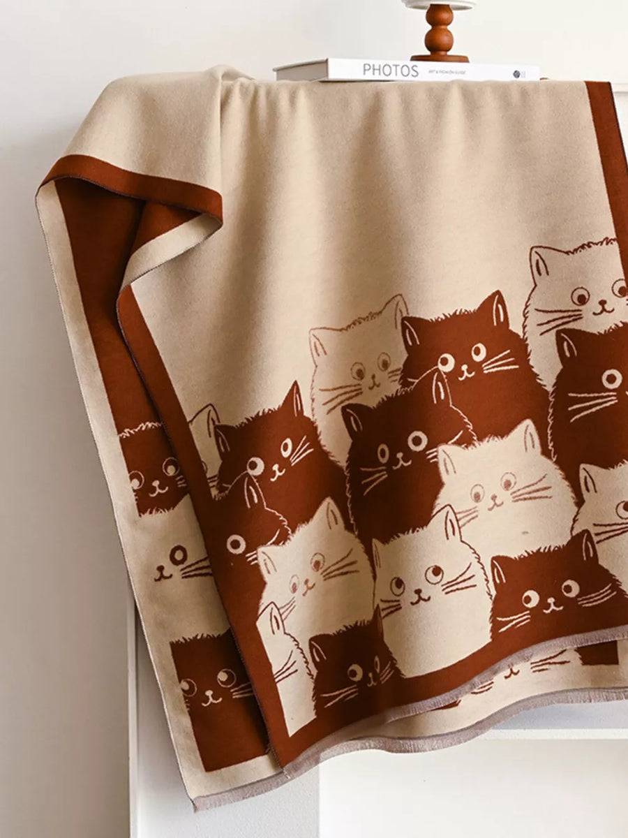 Charming reversible scarf in black brown with a playful cat pattern.