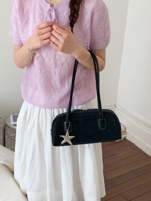 Black shoulder bag with star charm detail