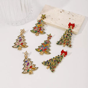 Festive rhinestone Christmas tree dangle earrings with colorful gems and red bows.