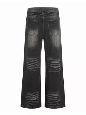 Men's black vintage wash wide leg jeans with distressed detailing
